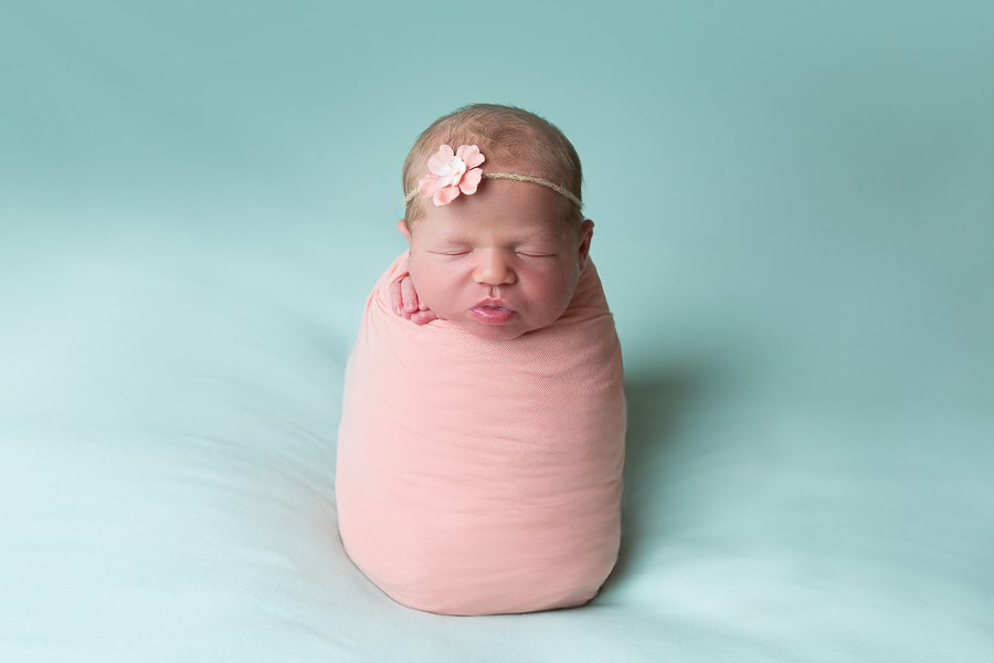 newborn girl in potato sack pose