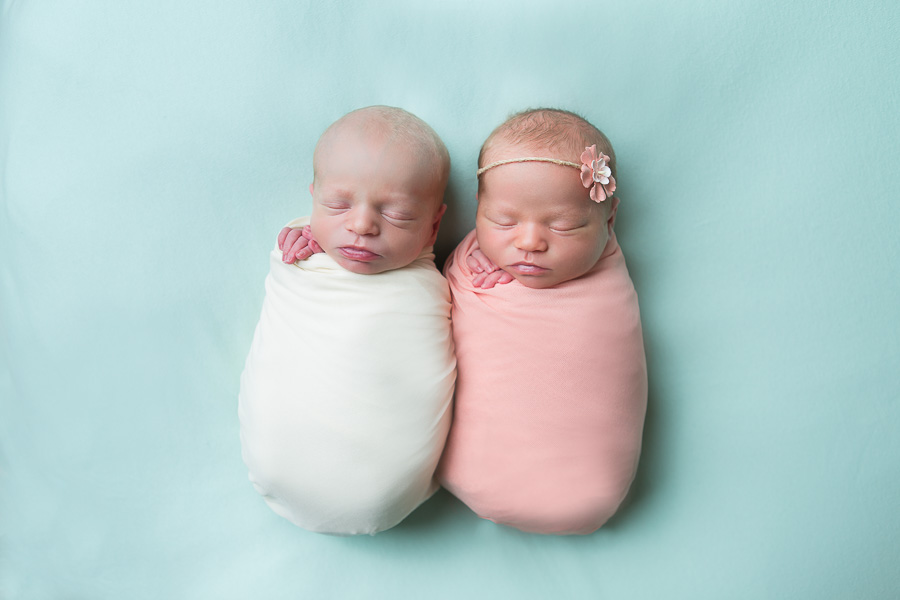 newborn twins swaddled
