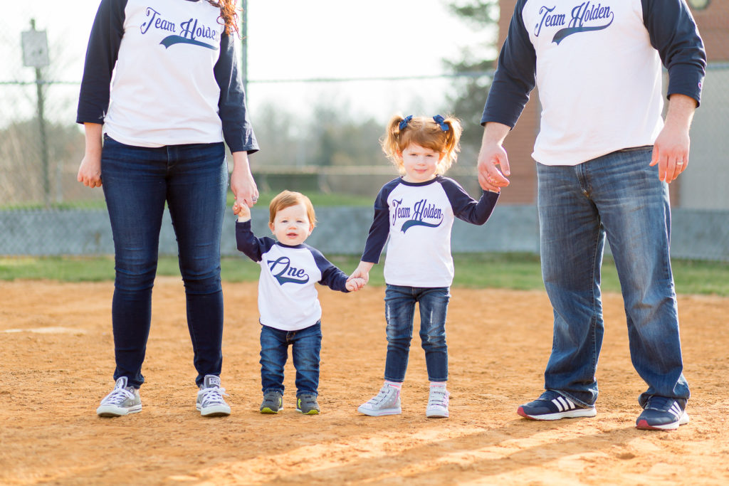 family of four in baseball shirts