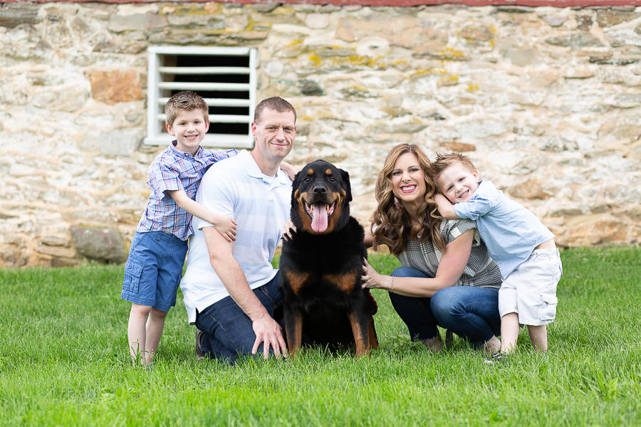 family of four with pet dog