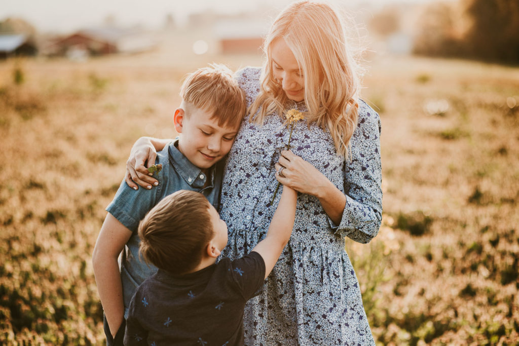 mother and kids pose with boys