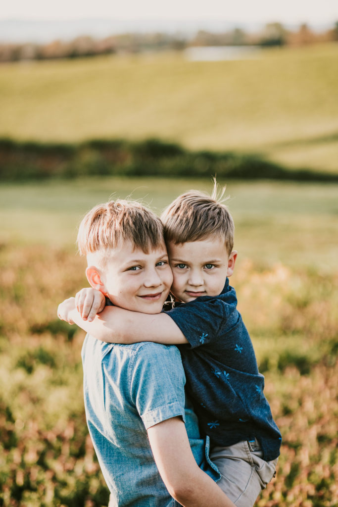 adorable brothers hugging